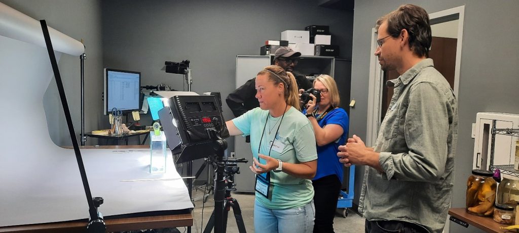 Scientist and Imaging Lab Manager, Zachary Randall, works with teachers to photograph fish specimens.