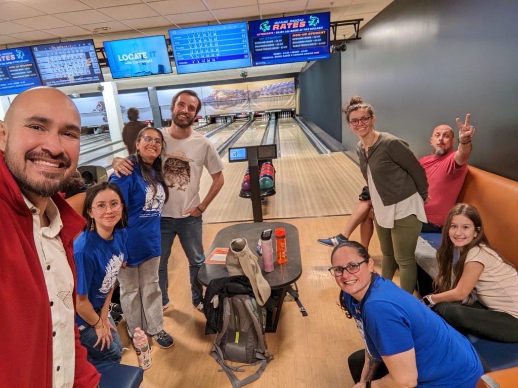 group photo of people at a bowling alley