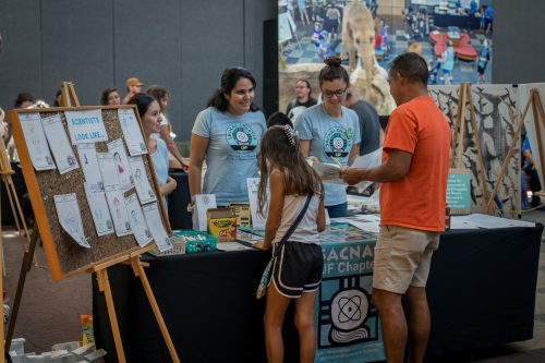 SACNAS members speaking to visitors at an event at the Florida Museum