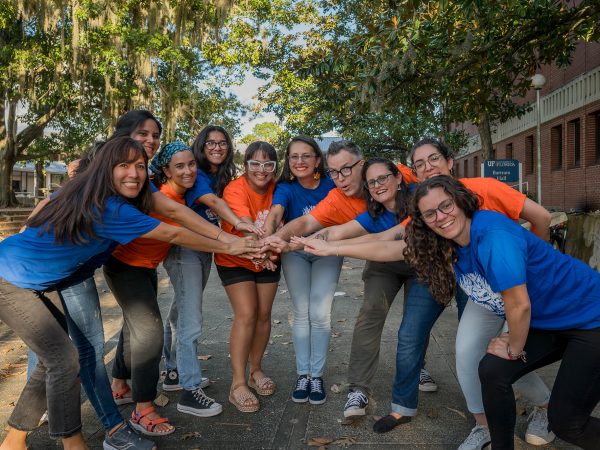 group photo with everyone in blue or orange t-shirts