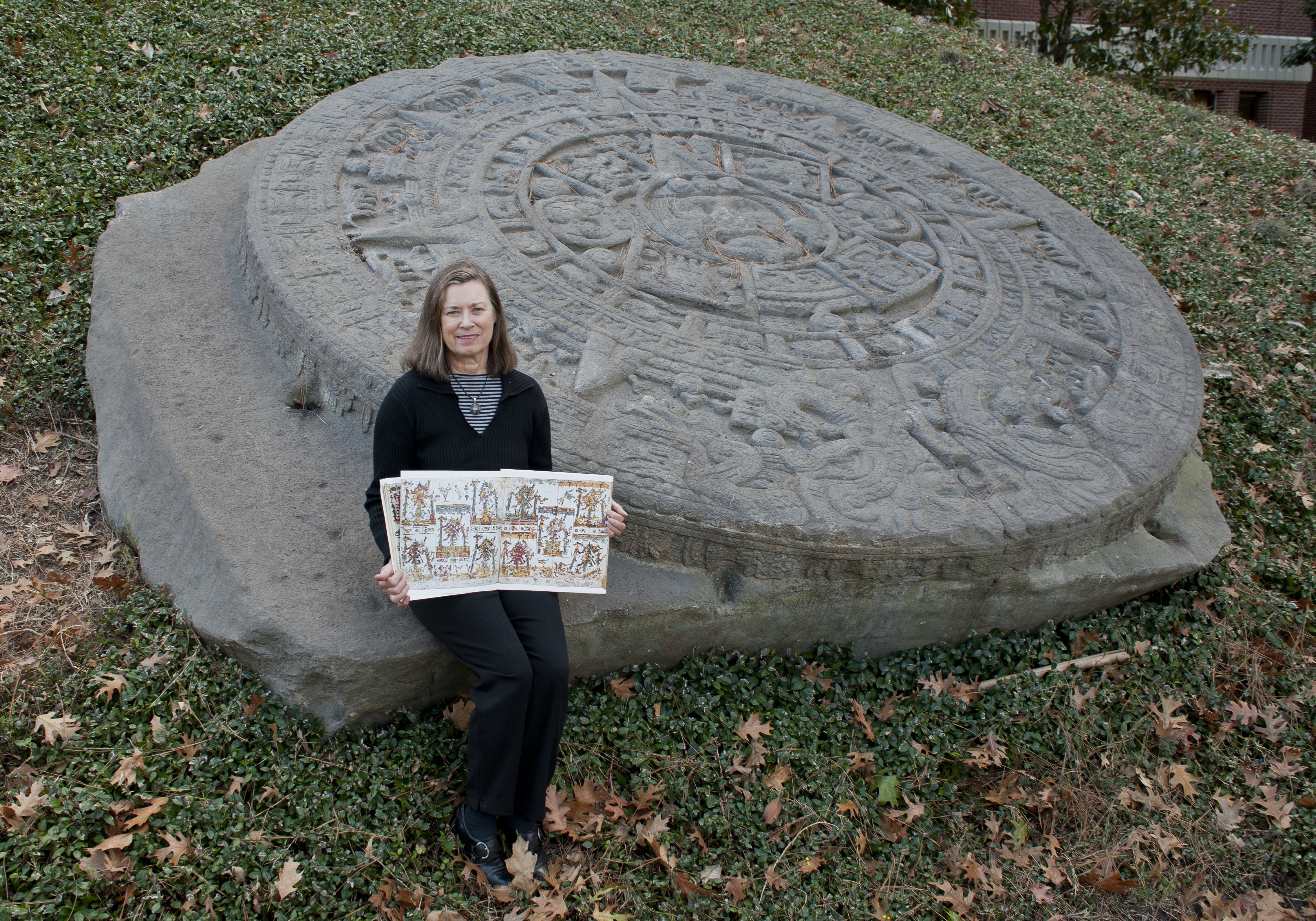 Susan Milbrath pictured with replica of the Aztec sun stone in the
