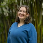 Aleida smiling in front of bamboo